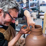 Doug Fitch and Hannah McAndrew making a jug for me